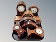 A group of seven mahogany and oak mantel clocks