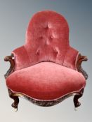 A Victorian carved walnut salon chair in buttoned dralon