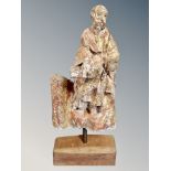 A 17th century Spanish carved and gilt wood figure of Saint Paul, on a contemporary oak stand,