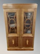 A late 19th century Danish mahogany and satin wood inlaid bookcase,