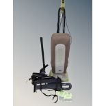 Two Oreck vacuum cleaners with accessories
