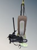 Two Oreck vacuum cleaners with accessories