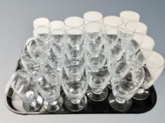A quantity of Scandinavian drinking glasses