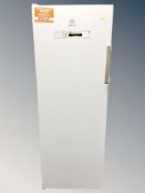 An Indesit upright freezer