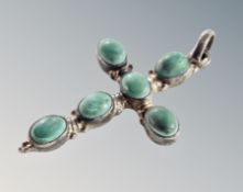 An old silver turquoise cross