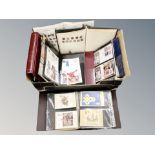 A box of several albums of stamps and first day covers