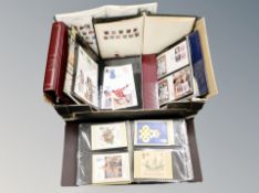 A box of several albums of stamps and first day covers