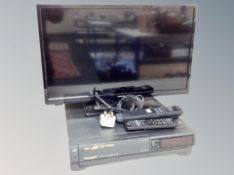 A Toshiba 24 inch LCD TV with lead and remote together with Panasonic video cassette recorder