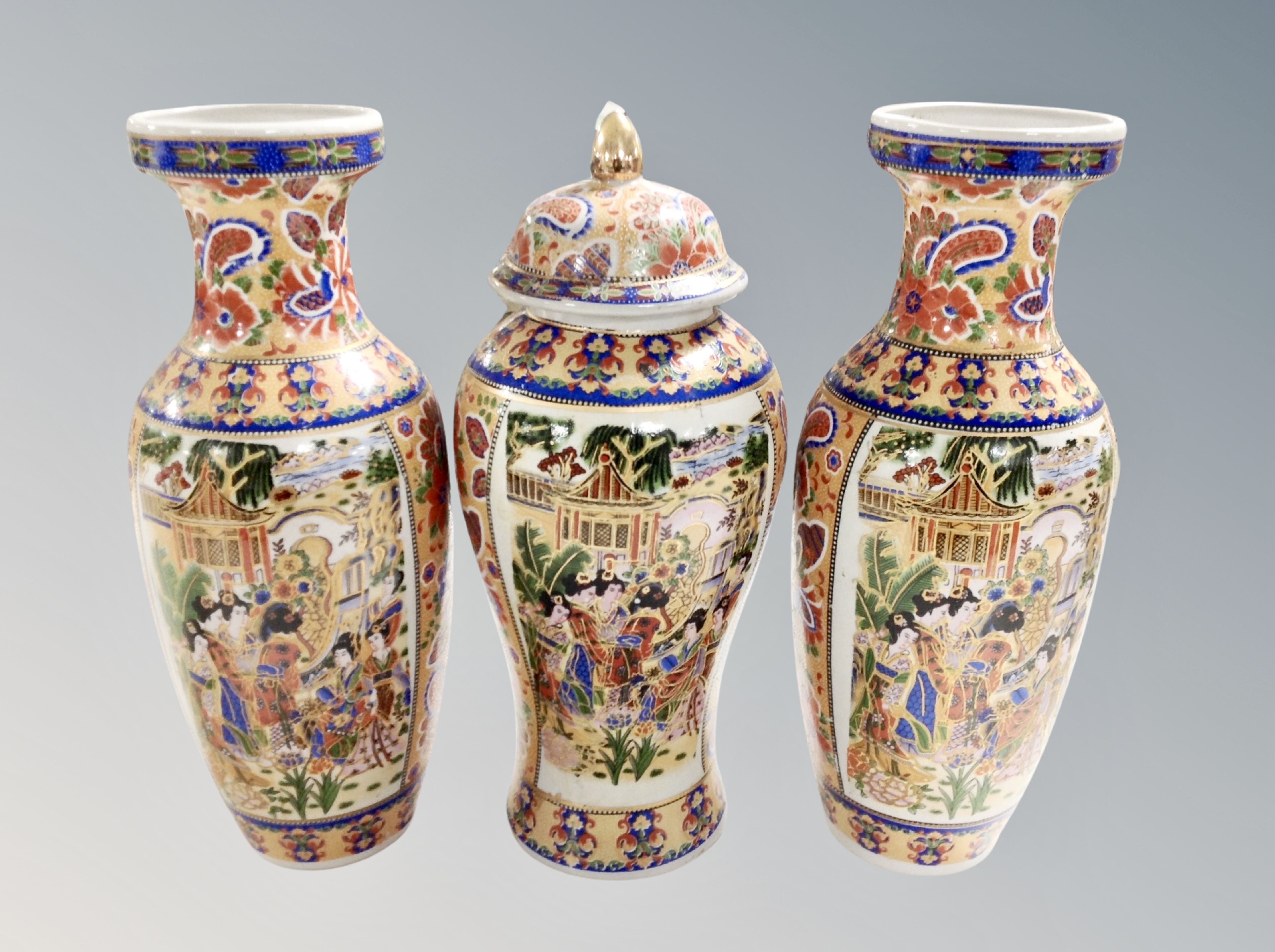 A garniture of three Japanese earthenware vases ,