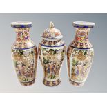 A garniture of three Japanese earthenware vases ,