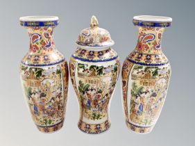 A garniture of three Japanese earthenware vases ,