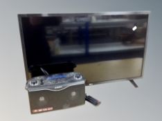 An LG 32 inch LCD TV with lead and remote and a Roberts radio