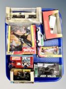 A group of boxed and unboxed die cast vehicles, military jeeps,