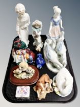 A Bavarian porcelain figure of a woman and geese, Nao figure of a boy, Nao clown,