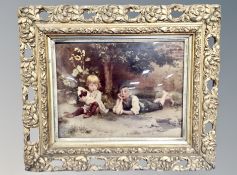 A Victorian crystoleum depicting two children, in ornate gilt frame,