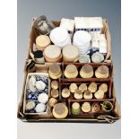 Two boxes of Danish glazed earthenware, kitchen pots on wooden racks, ramekins,