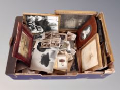 A box of monochrome photographs,