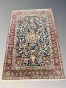 A Kashan rug,
