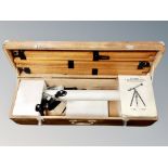 A Japanese refractor telescope with tripod in wooden box