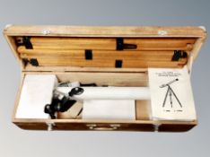 A Japanese refractor telescope with tripod in wooden box