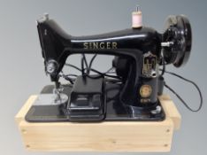 A Singer 99K electric sewing machine with lead and pedal