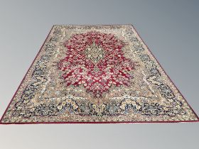 A machine made carpet of Persian design 352 cm x 249 cm