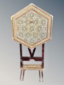 A Syrian mother of pearl inlaid hexagonal tilt top table,