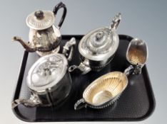 A silver plated three piece tea service and two further teapots