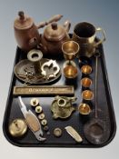 A group of brass and copper wares, tea pot, chocolate pot, brass chamber stick, keys, weights,