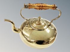 A brass kettle and a Victorian brass footman