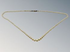 A graduated cultured pearl necklace with yellow gold clasp and a collection of costume jewellery