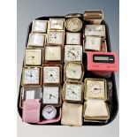 A collection of travelling timepieces in cases