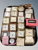 A collection of travelling timepieces in cases