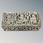 An Indian silver box depicting gods and deities, 10.5cm by 4.5cm by 3.5cm.
