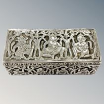 An Indian silver box depicting gods and deities, 10.5cm by 4.5cm by 3.5cm.