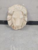 A concrete lion wall mask,
