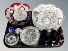 A two-tone clear and ruby glass fruit bowl together with further glass ware, paperweights,