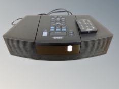 A Bose wave radio/cd player with lead and remote