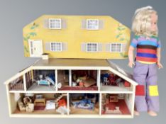 A doll's house and plastic doll