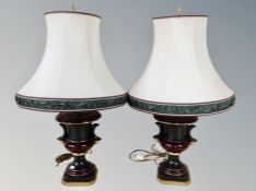 A pair of contemporary urn shaped table lamps with shades,