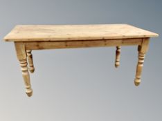 An early 20th century pine farmhouse kitchen table,