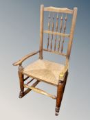 An elm farmhouse rocking chair with rattan seat