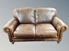 A Barker & Stonehouse brown leather two seater settee,