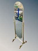 A brass cheval mirror,