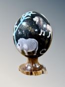An ostrich egg with transfer printed decoration,