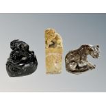 A Chinese carved soapstone scroll weight in the form of a foo dog, height 12 cm,