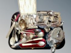 A group of plated wares, set of teaspoons in box, large ladle, desk standish, cutlery,