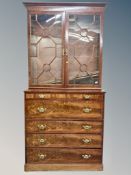 A George III mahogany secretaire bookcase, width 116 cm, height 243 cm.