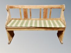 An early 20th century pine bench,