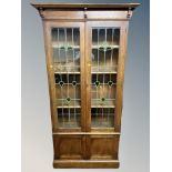 A late Victorian oak Arts and Crafts bookcase,